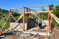 Mama Dabida Dowansiba Gembira, Rumah Mulai Dipasang Dinding Oleh Satgas TMMD Ke-128 Kodim 1801/Manokwari